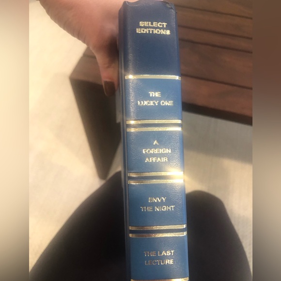 Anthropologie: Hand cut letters from Reader’s Digest books. Spells out “HOME.” - Picture 14 of 15